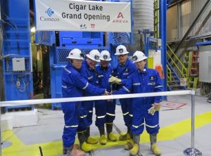 Cameco President Tim Gitzel (second from right) is joined by industry partners including Bill Boyd, Minister Responsible for Energy and Resources, for the official ribbon cutting ceremony at the Cigar Lake Mine. Photo by Mervin Brass.